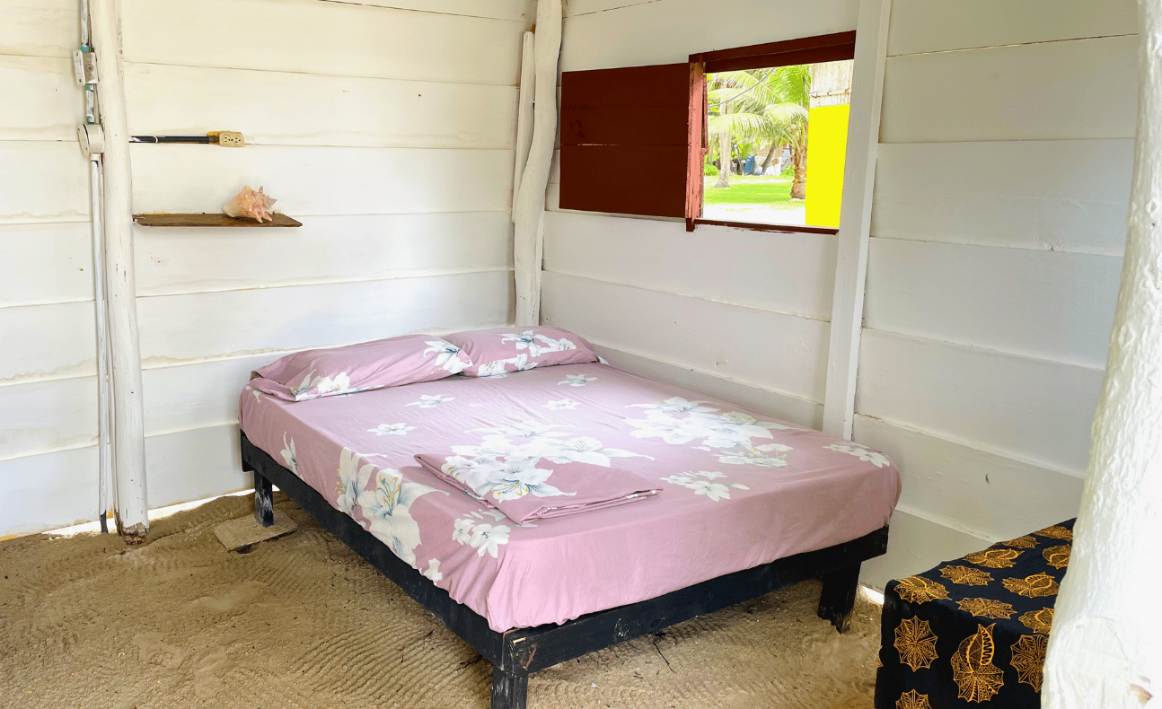 Interior of traditional wooden accommodation with sand floor on Chichime Island, San Blas Archipelago, Panama – an authentic overnight experience from Panama City