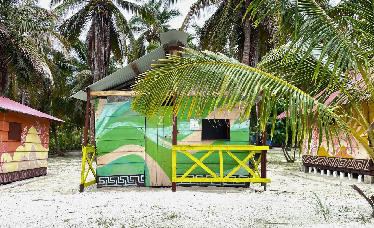 Beautifully painted tropical wooden cabin on Chichime Island, San Blas Islands, Panama – perfect for travelers seeking an island escape from Panama City